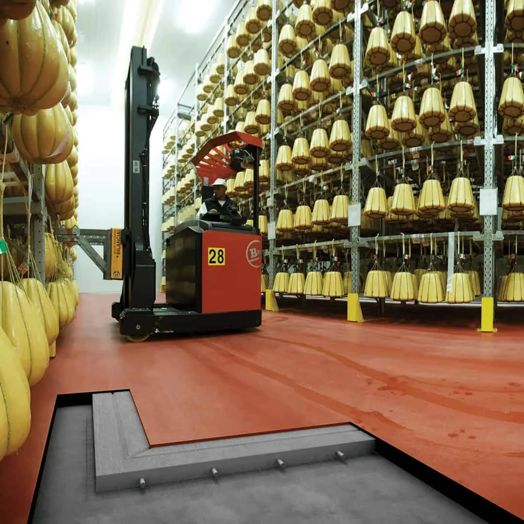 Red heavy-duty resin floor in a commercial retail area